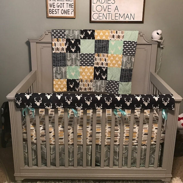 Custom Crib Bedding Set with a woodland theme featuring deer and arrows in navy, mustard yellow, mint and tan, gender neutral baby bedding