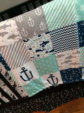 Double Minky Baby Blanket in navy and gray with a nautical theme including anchors, Sharks, fish and chevron