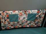 Patchwork Baby Blanket in turquoise and orange with a modern woodland look with foxes, arrows and a broken chevron in Orange, turquoise