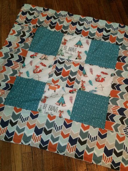 Patchwork Baby Blanket in turquoise and orange with a modern woodland look with foxes, arrows and a broken chevron in Orange, turquoise