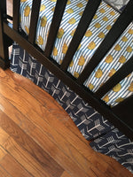 Where the Wild Things Are inspired crib bedding set in navy, gray and a golden yellow with woodland fabrics of arrows, crowns, tans trees