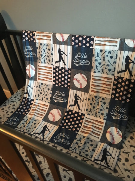 Double Minky Baby Blanket in navy and gray with a baseball theme including baseball players, bats and balls