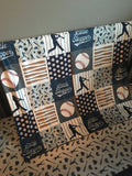 Double Minky Baby Blanket in navy and gray with a baseball theme including baseball players, bats and balls