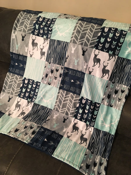 Baby Boy Double Minky Baby blanket in navy, mint and gray with a woodland theme incorporating deer, arrows, canoes, antlers and mountains