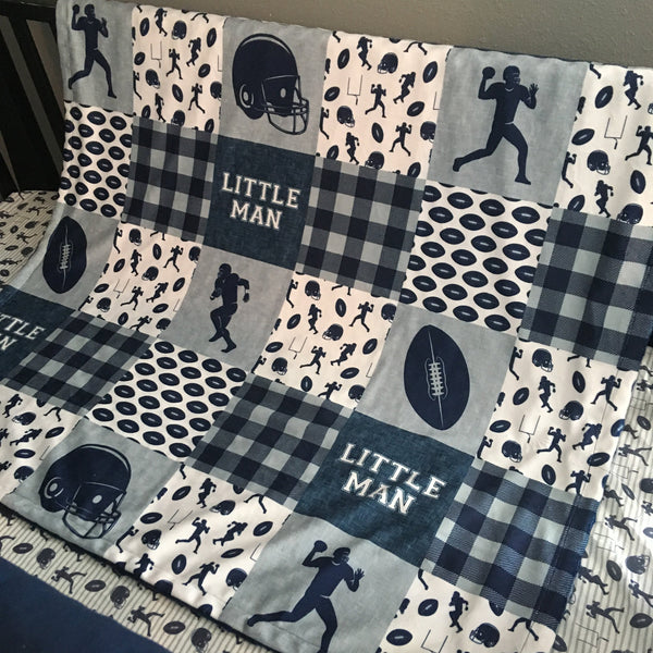 Baby Boy Double Minky Blanket with a Football Theme in navy and gray, designs include helmets, footballs, plaid, goal posts and players