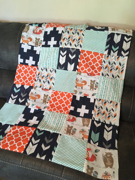 READY TO SHIP - Patchwork blanket with a modern woodland theme including foxes and bears, trees, and arrows in orange, navy, and mint