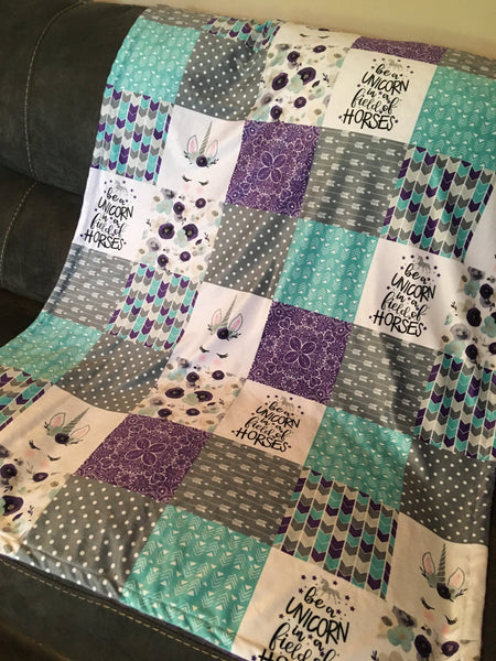Double Minky Baby Girl Blanket in purple, turquoise, and gray with a unicorn theme with floral, arrows, paisley and polka dots