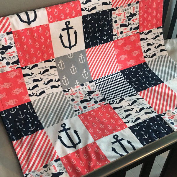 Double Minky Baby Blanket in coral pink, navy and gray with a nautical theme including anchors, Sharks, fish and chevron