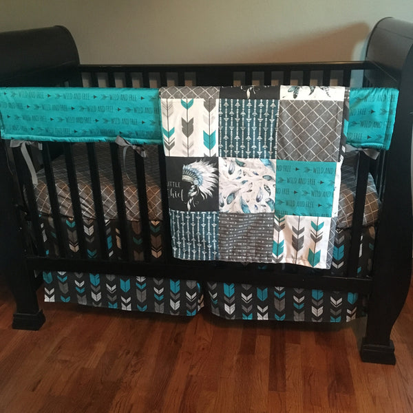 Wild and Free Baby Boy Bedding in turquoise, black and gray with a modern boho tribal theme with dream catchers, little chief, and feathers