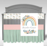 Baby Girl Crib Bedding Set with a rainbow theme in pink, mint and yellow with a personalized blanket with a boho floral rainbow