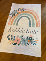 Baby Girl Crib Bedding Set with a rainbow theme in pink, mint and yellow with a personalized blanket with a boho floral rainbow