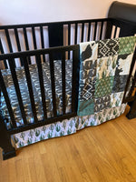 Made to Order Baby Bedding with a western boho theme with cactus, cow, and Aztec prints in dark green, gray and black