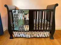 Made to Order Baby Bedding with a western boho theme with cactus, cow, and Aztec prints in dark green, gray and black