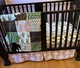 Custom Baby Bedding with a western boho theme with cow hide, cactus, Aztec, succulents, in neutral colors, tan, green, and brown