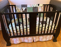 Custom Baby Bedding with a western boho theme with cow hide, cactus, Aztec, succulents, in neutral colors, tan, green, and brown