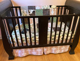 Custom Baby Bedding with a western boho theme with cow hide, cactus, Aztec, succulents, in neutral colors, tan, green, and brown